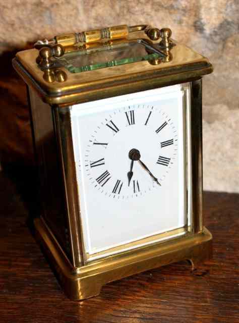 Appraisal: A FRENCH GILT BRASS CARRIAGE TIMEPIECE in corniche case with