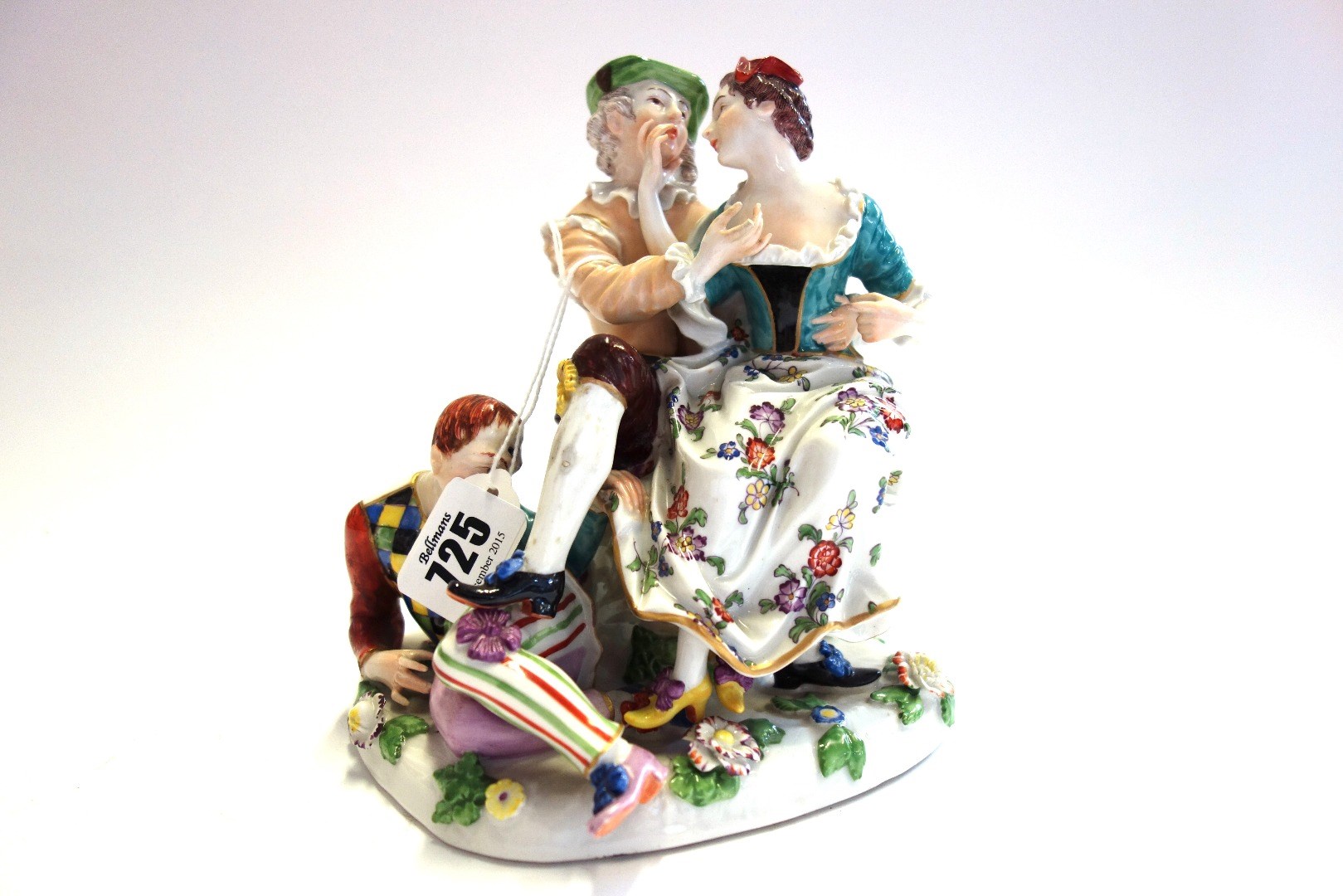 Appraisal: A Continental porcelain figure group of 'The Indiscreet Harlequin' after