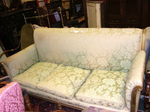 Appraisal: A pale green floral upholstered sofa th century the rolled