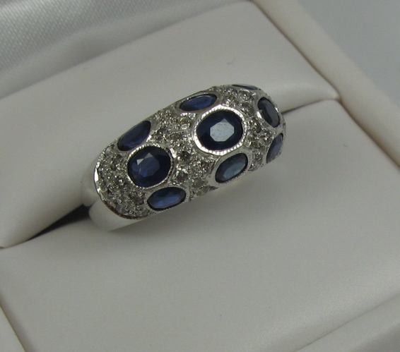 Appraisal: SAPPHIRE DIAMOND AND K WHITE GOLD RING set with nine