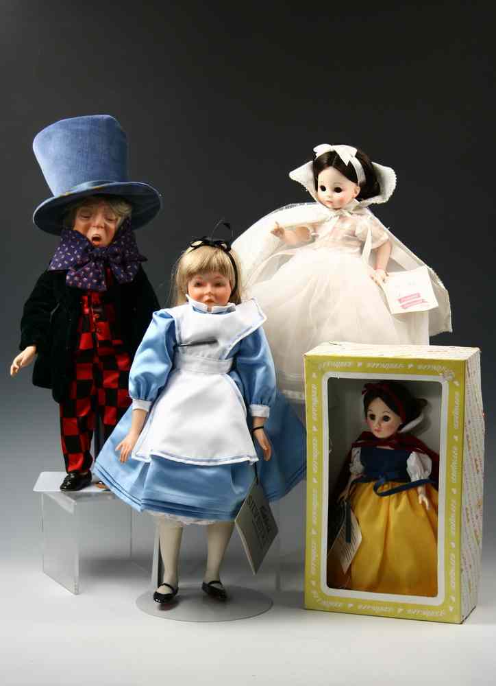 Appraisal: DOLL LOT - Four piece doll lot - 'Mad Hatter'