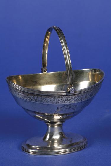 Appraisal: A GEORGE III SUGAR BASKET of boat form with a