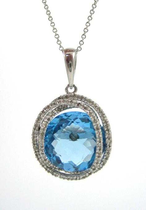 Appraisal: BLUE TOPAZ AND DIAMOND PENDANT NECKLACE with an inch k