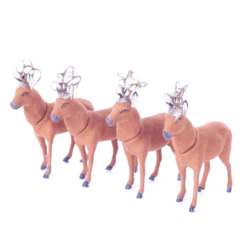 Appraisal: Four German felt covered paper mache reindeer Christmas candy containers