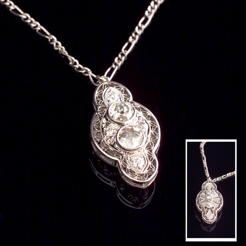 Appraisal: EDWARDIAN Diamond and platinum filigree pendant double-sided lozenge form One