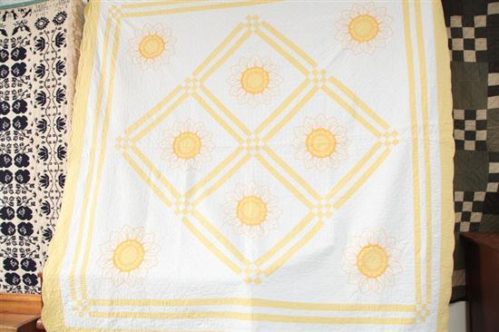 Appraisal: QUILT A yellow and white quilt with needlepoint applique flowers