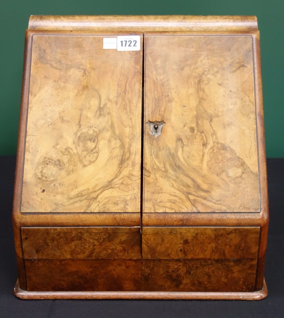 Appraisal: A Victorian figured walnut slope front stationery box with fitted