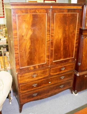 Appraisal: A George III mahogany linen press circa the two panelled