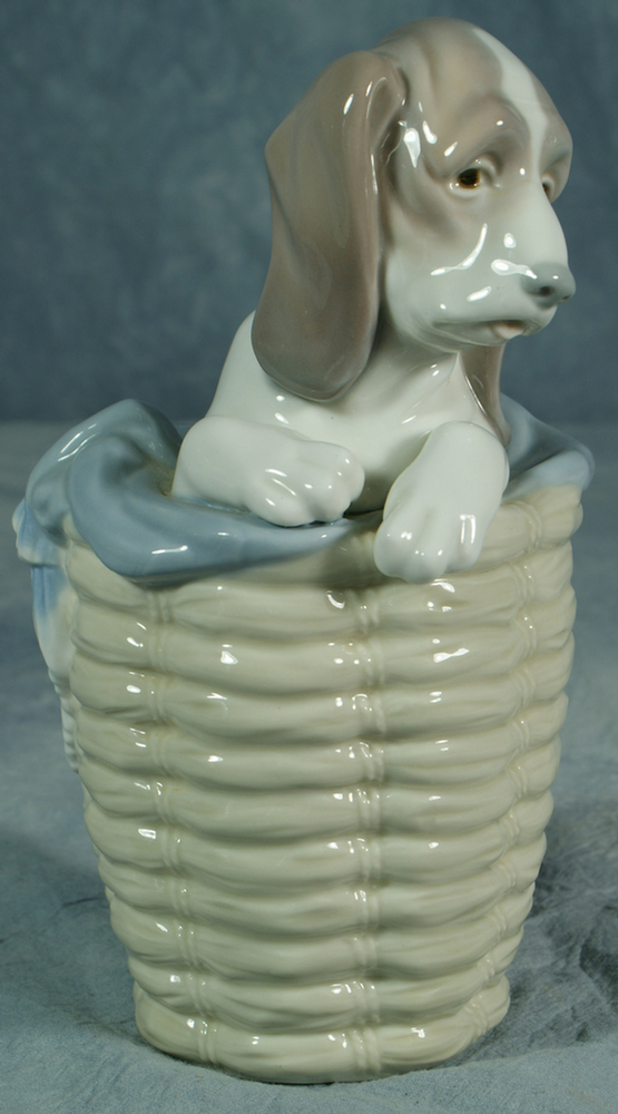 Appraisal: Lladro figurine bloodhound in basket tall no damage Estimate -