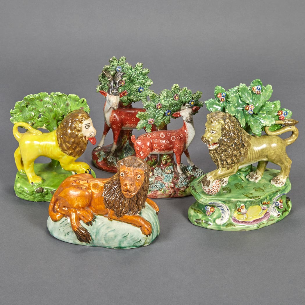 Appraisal: Three Staffordshire Pottery Figures of Lions and a Pair of