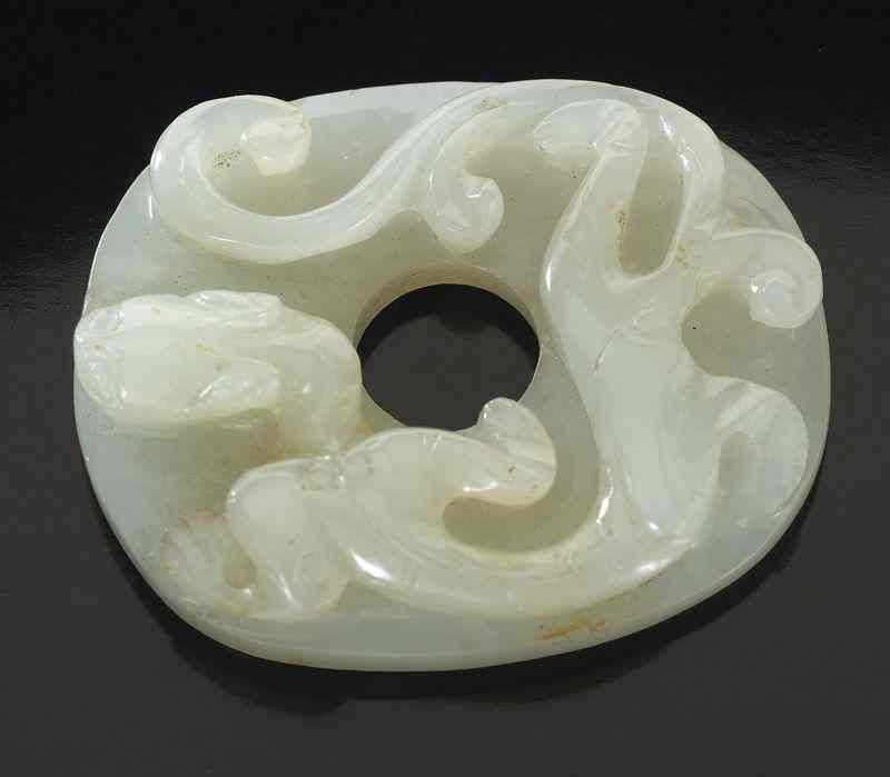 Appraisal: Chinese Ming carved jade pendantdepicting a chi-dragon ''H x ''W