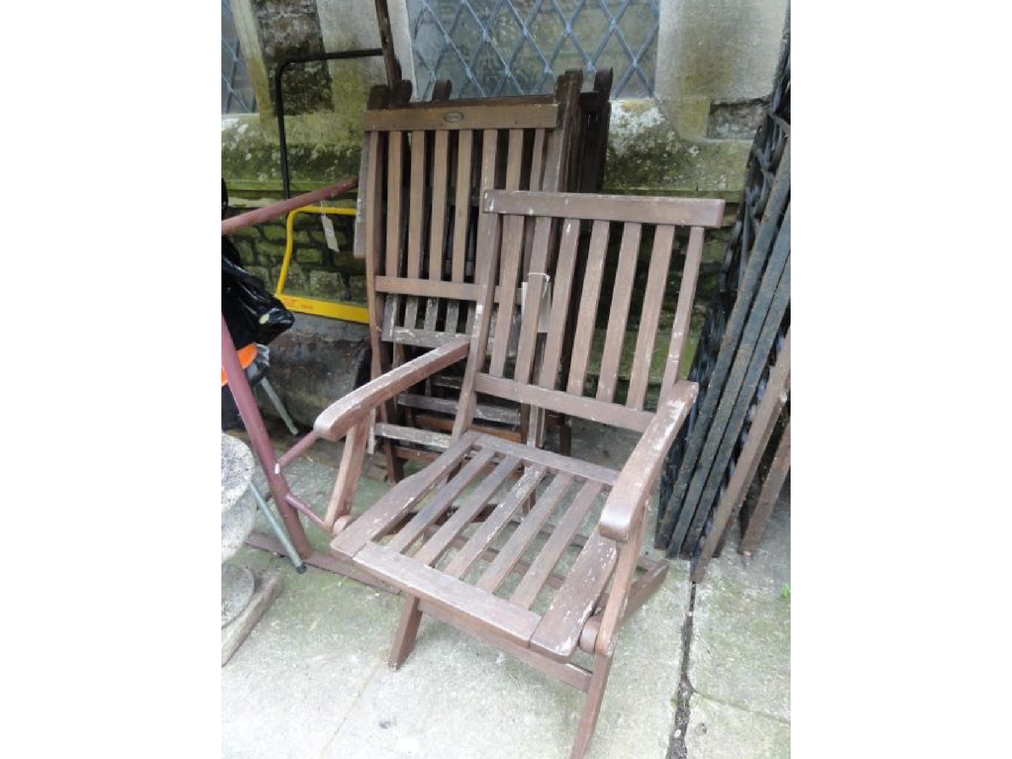 Appraisal: A set of four contemporary stained hardwood folding armchairs with