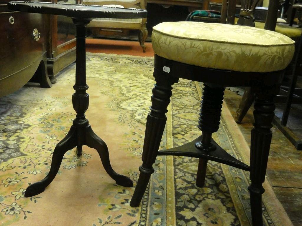 Appraisal: A th century mahogany piano music stool of circular form