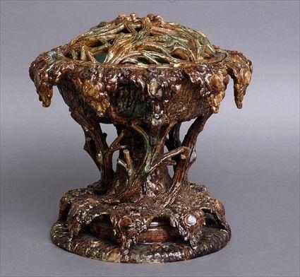 Appraisal: ENGLISH BROWN-GLAZED POTTERY TREE-FORM BRAZIER AND COVER The bark-textured bowl