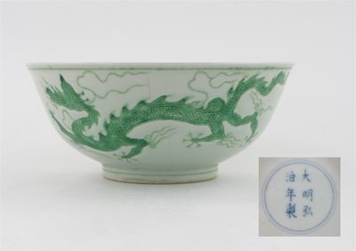 Appraisal: A Chinese green dragon bowl the exterior incised and painted