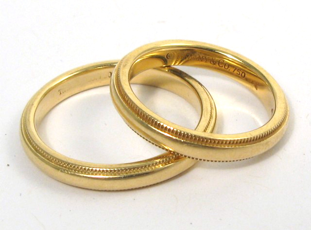 Appraisal: TWO TIFFANY CO EIGHTEEN KARAT GOLD RINGS both marked 'Tiffany