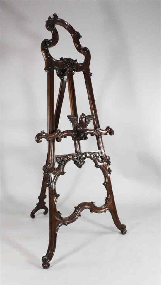 Appraisal: A th century French carved walnut easel Louis IV design