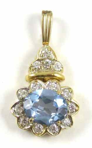 Appraisal: SYNTHETIC BLUE SPINEL AND DIAMOND PENDANT set with round-cut diamonds