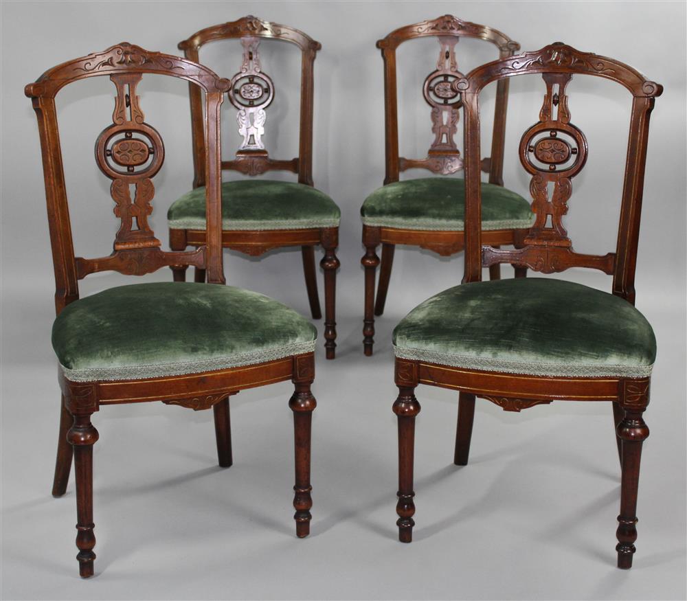 Appraisal: FOUR AESTHETIC MOVEMENT CARVED WALNUT SIDE CHAIRS each having a