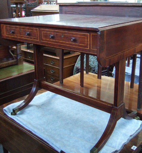 Appraisal: An early th century mahogany sofa table the rosewood and