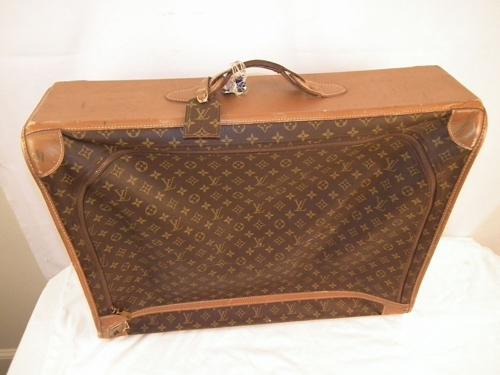 Appraisal: LOUIS VUITTON SUITCASE Old Louis Vuitton suitcase x inches some