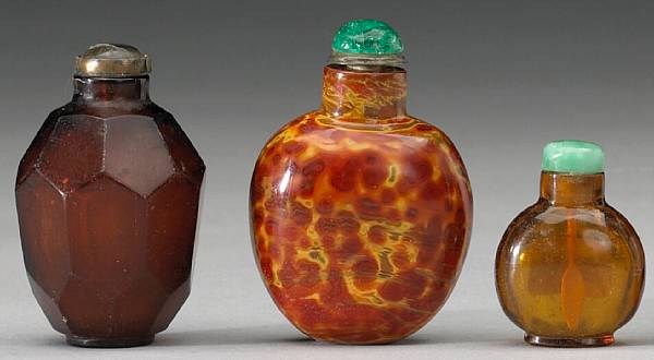 Appraisal: Four glass snuff bottles th Century The first of faceted