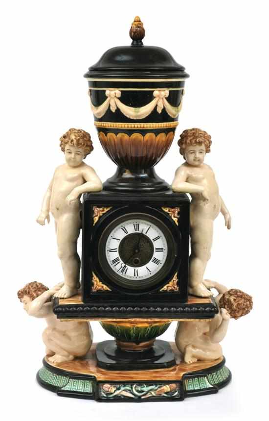 Appraisal: A continental majolica glazed mantel clock th century The enamelled