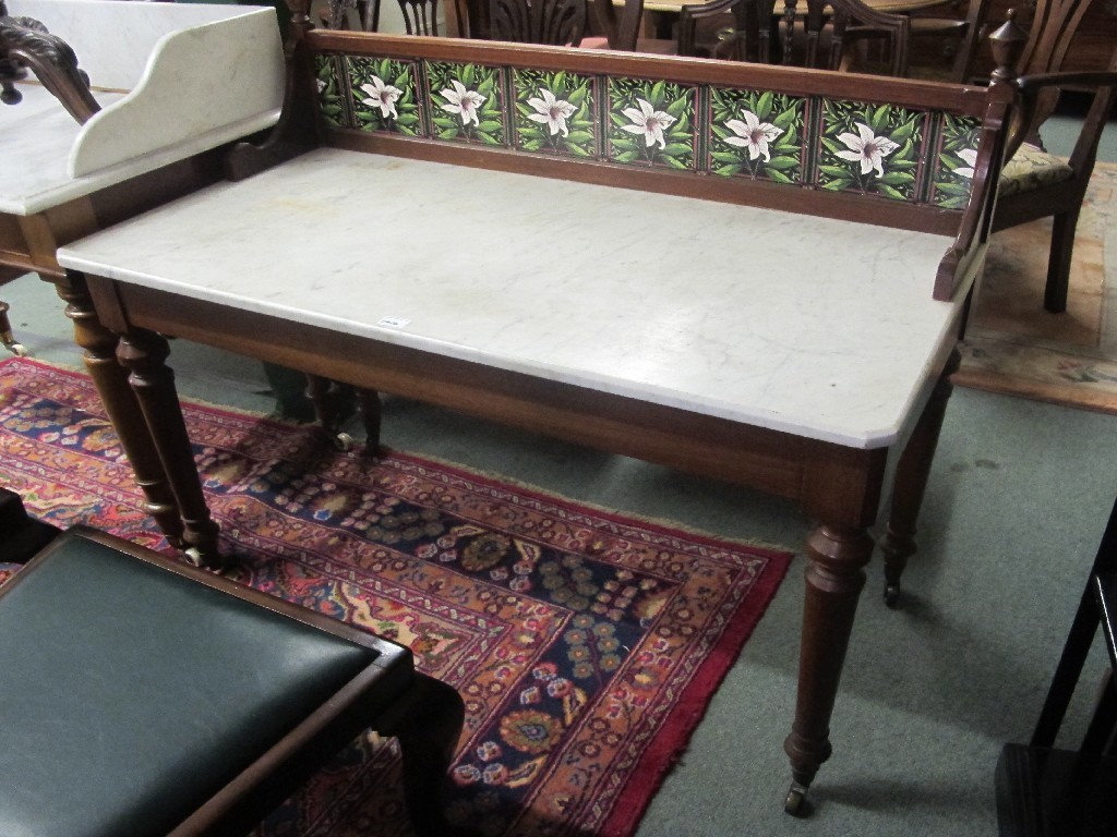 Appraisal: Late Victorian mahogany washstand with tiled back and marble top