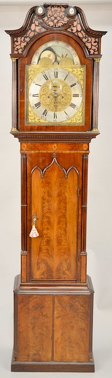 Appraisal: Mahogany tall case clock having carved finials with fretwork backed