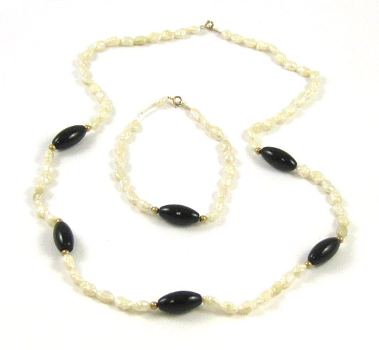 Appraisal: TWO ARTICLES OF PEARL AND BLACK ONYX JEWELRY including a