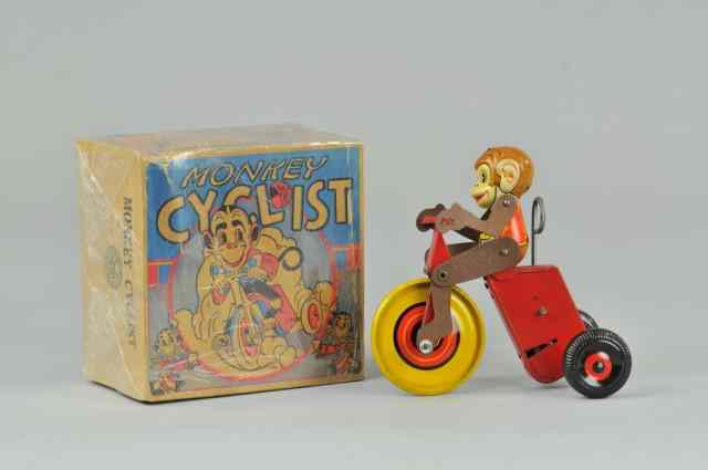 Appraisal: BOXED MONKEY CYCLIST Marx lithographed tin with cardboard articulated jointed