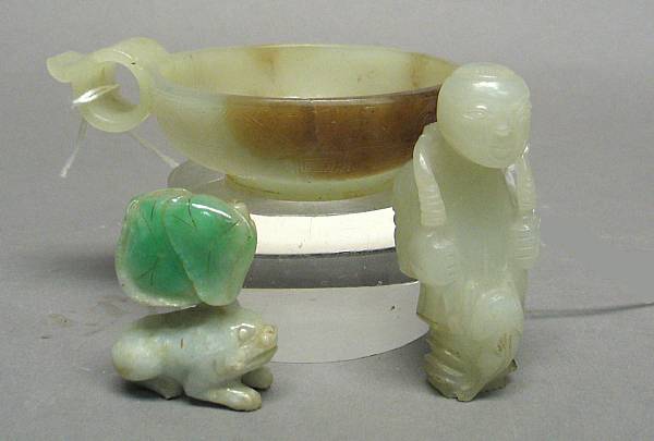 Appraisal: A nephrite libation cup Resting on a slightly flared circular