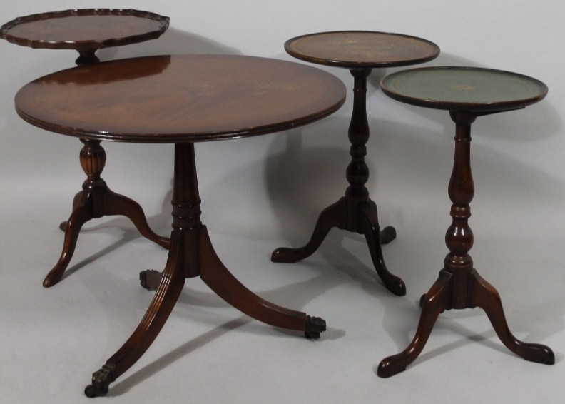 Appraisal: A mahogany finished tripod wine table the dish top with