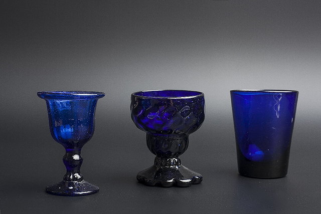 Appraisal: A BLUE GLASS MONTEITH with honeycomb moulding cm high together