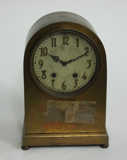 Appraisal: An arch top brass mantel clock fitted an eight-day movement