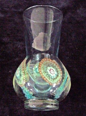 Appraisal: A paperweight vase of greenish glass and of thistle shape