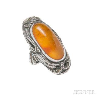 Appraisal: Silver and Amber Ring centering an elongated amber cabochon framed