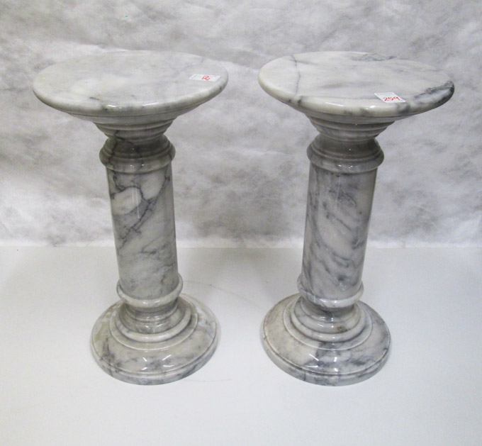 Appraisal: A PAIR OF CARRARA MARBLE PEDESTALS both of solid gray