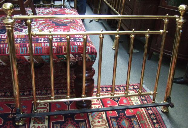 Appraisal: A Victorian style brass bedstead with turned decoration and ball