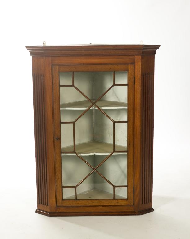 Appraisal: th CENTURY MAHOGANY GLAZED HANGING CORNER CUPBOARD with moulded cornice