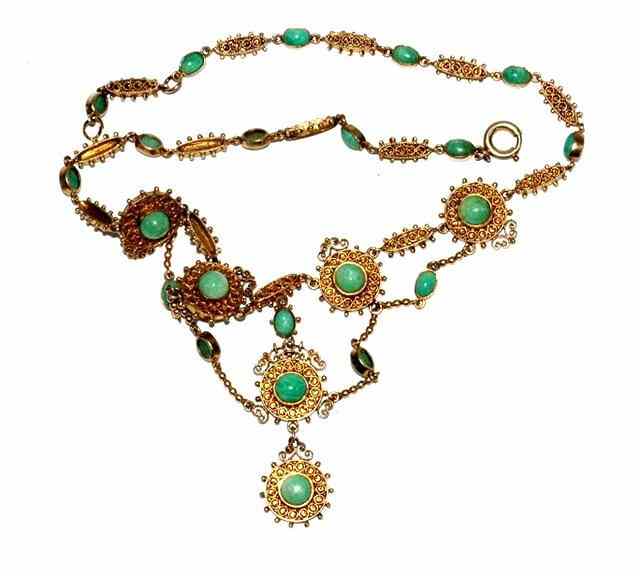 Appraisal: A CONTINENTAL SILVER GILT AND GREEN HARDSTONE NECKLACE with twisted