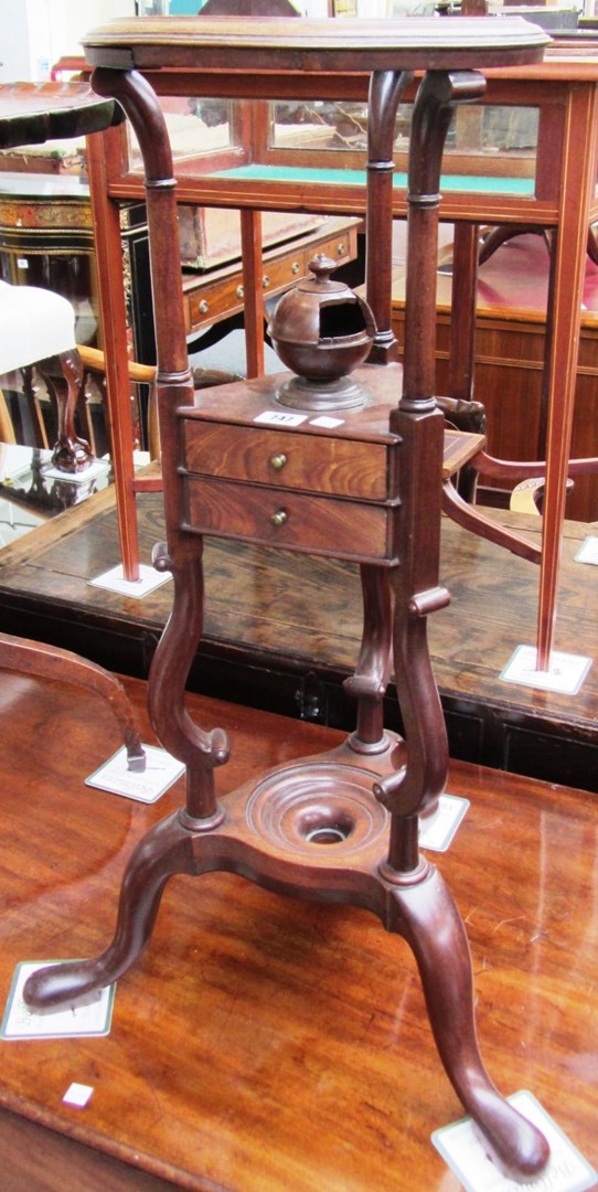 Appraisal: An th century mahogany tripod wash stand