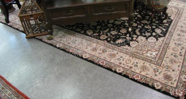 Appraisal: A handmade Oriental rug Tabriz type design black field with