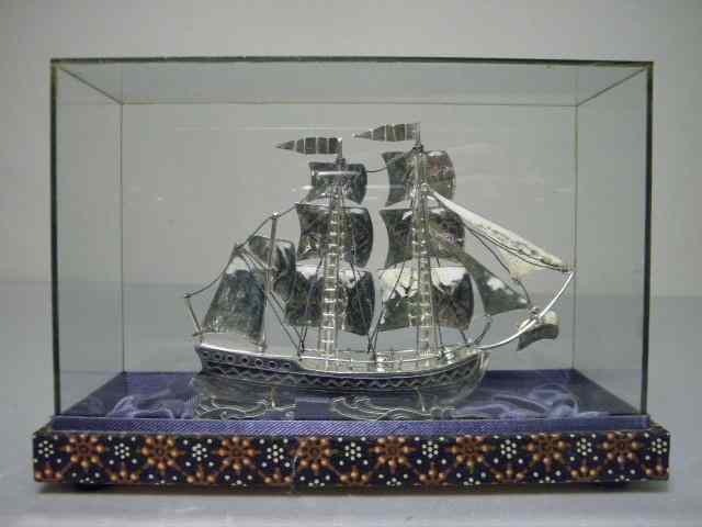 Appraisal: Sterling silver ship sculpture With stand and glass display case