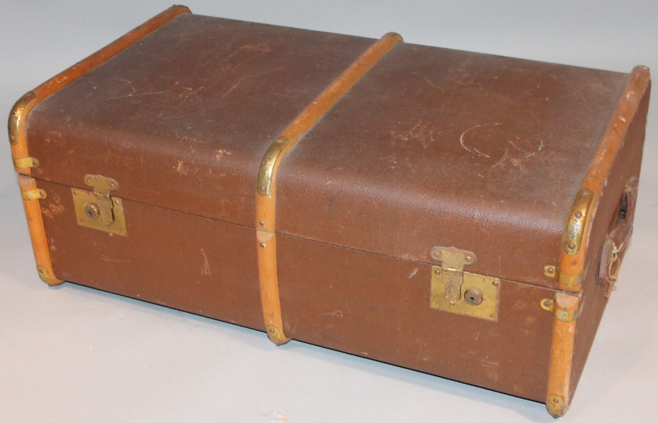 Appraisal: An early thC pressed leather and wooden bound travel trunk