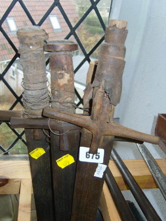 Appraisal: Four primitive swords with steel blade and simple ironwork hilts