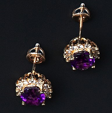 Appraisal: A pair of amethyst and diamond cluster earstuds each oval