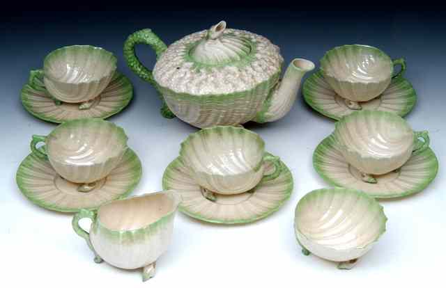 Appraisal: A BELLEEK NAUTILUS TEA SET TO INCLUDE a teapot cream