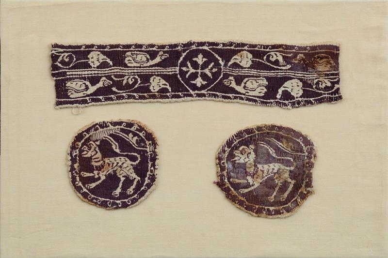 Appraisal: COPTIC TEXTILE PURPLE SLEEVE BAND WITH CROSS AND GALLINULES RONDELS