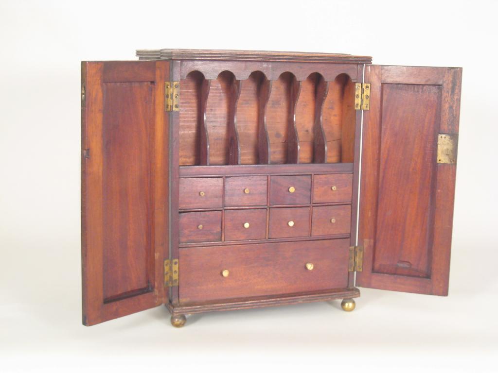 Appraisal: A Georgian mahogany Apothecary's Cabinet double sided and fitted interior